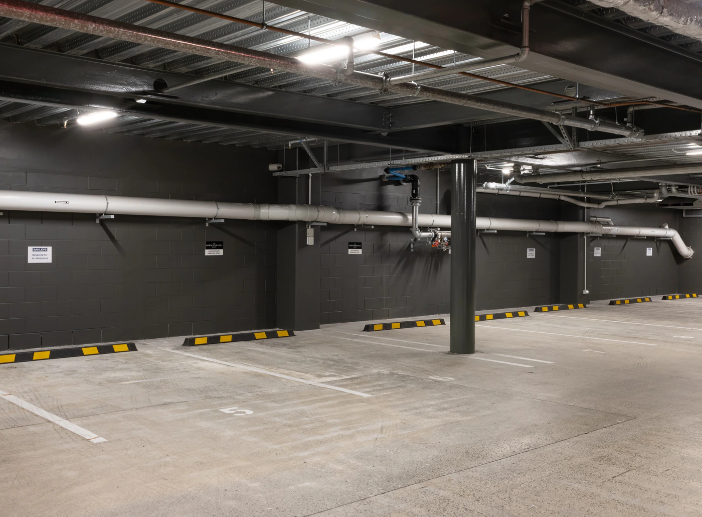 Underground car park with marked parking spaces