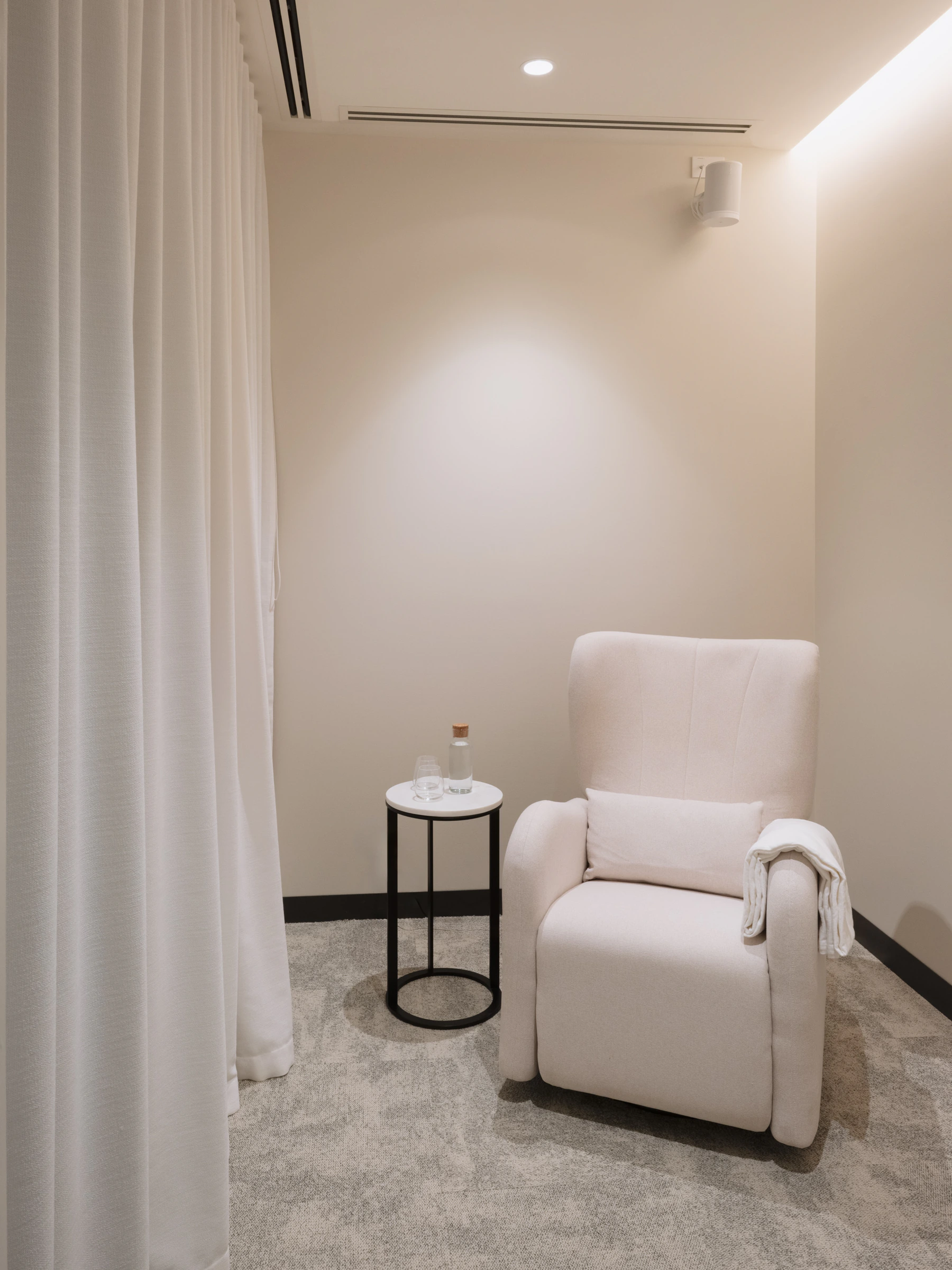 The Dermatology Group private recovery room with lounge chair